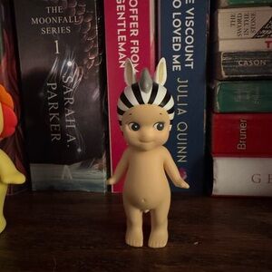 Zebra Striped Doll Figure